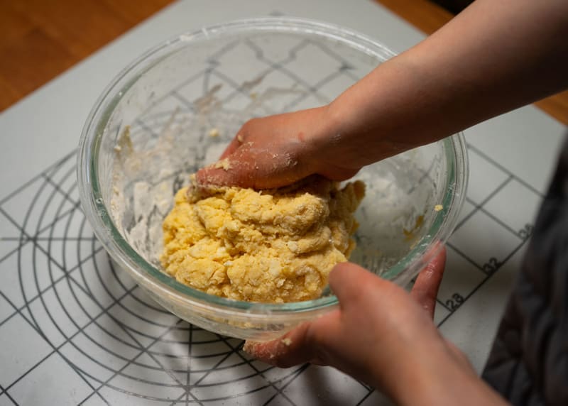 Hands kneading fresh dough